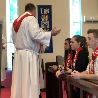 Confirmands kneeling